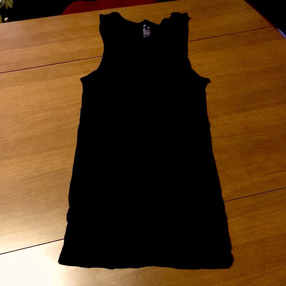 Never worn women’s black ribbed extra long tank. Size Medium (38-40)
